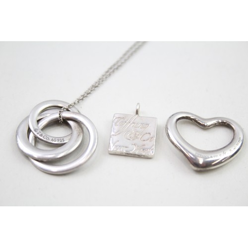 318 - A silver necklace and two pendants by Tiffany and Co (16g)