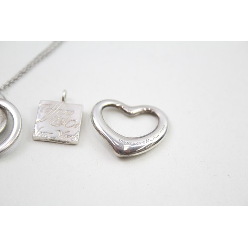 318 - A silver necklace and two pendants by Tiffany and Co (16g)