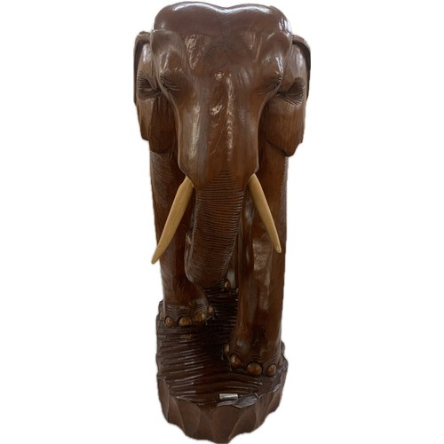 273 - Large wooden carved elephant figure and a small carved wooden elephant- largest measures approx 25 i... 