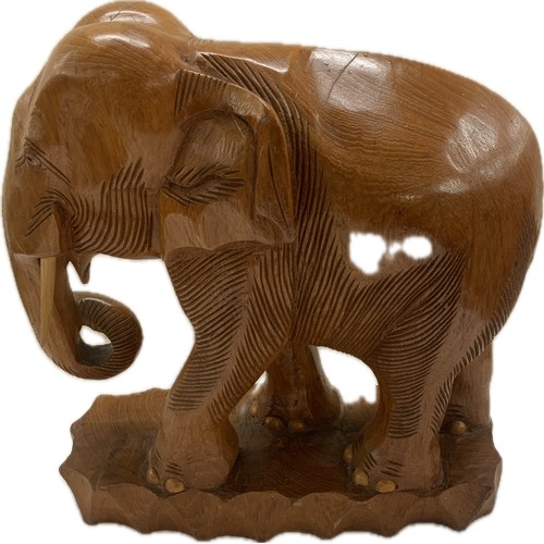 273 - Large wooden carved elephant figure and a small carved wooden elephant- largest measures approx 25 i... 