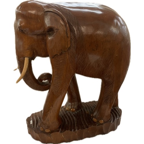 273 - Large wooden carved elephant figure and a small carved wooden elephant- largest measures approx 25 i... 