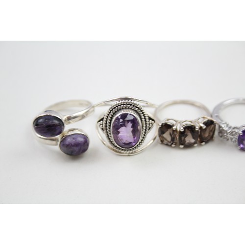 306 - A collection of silver stone set rings including amethyst and topaz (30g)