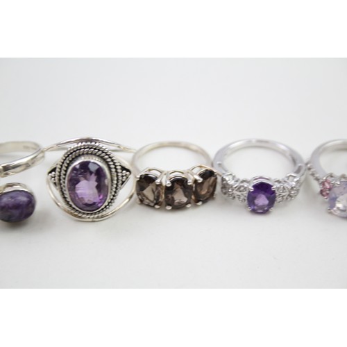 306 - A collection of silver stone set rings including amethyst and topaz (30g)