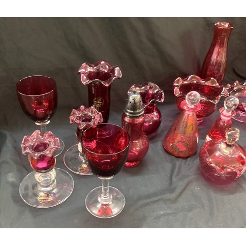 162A - Selection of cranberry glass ware to include Royal Scot candle sticks, pepper shaker, glasses, jug e... 