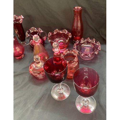 162A - Selection of cranberry glass ware to include Royal Scot candle sticks, pepper shaker, glasses, jug e... 