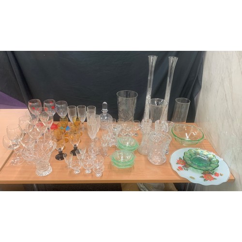 156 - Large selection of coloured and clear glassware to include long vases, bowls, glasses etc