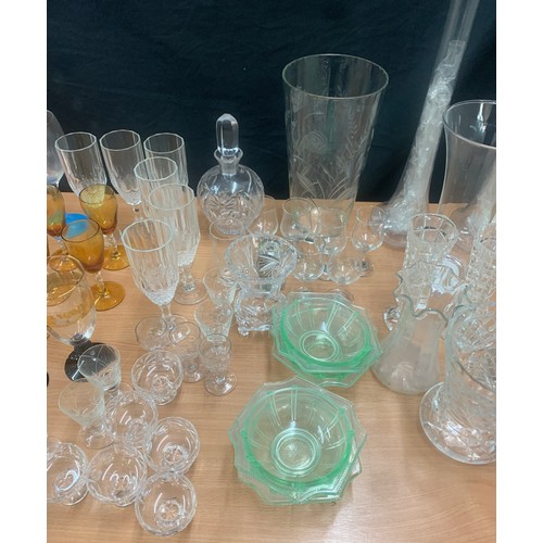 156 - Large selection of coloured and clear glassware to include long vases, bowls, glasses etc