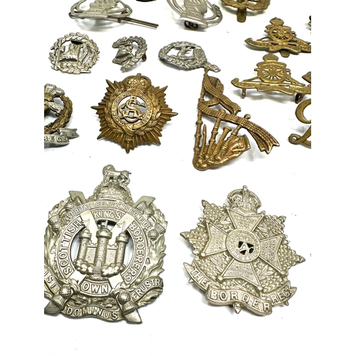 369 - selection of military badges inc cap badges etc