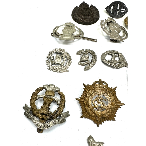 369 - selection of military badges inc cap badges etc