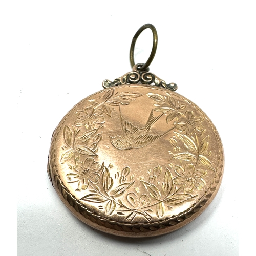 114 - Antique 9ct gold back & front locket measures approx 3.5cm drop by 2.9cm dia