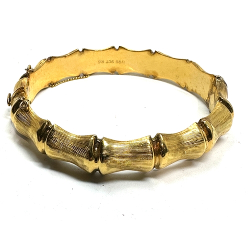 115 - 9ct 1/20th r.g gold bangle weight 20g