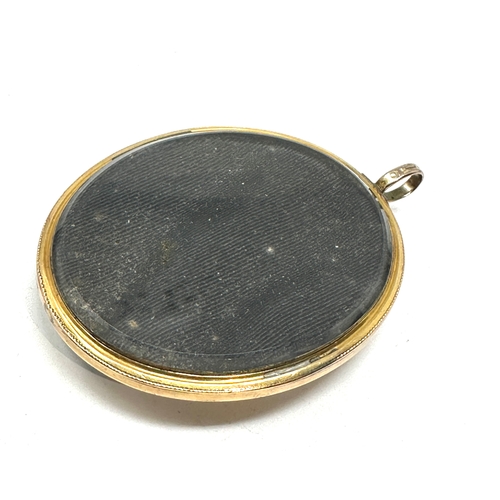 120 - large victorian yellow metal framed cameo pendant locket measures approx 6.5cm drop