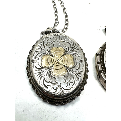 269 - 3 vintage silver lockets largest measures approx 5.6cm 2 having silver neclace chains weight 51g