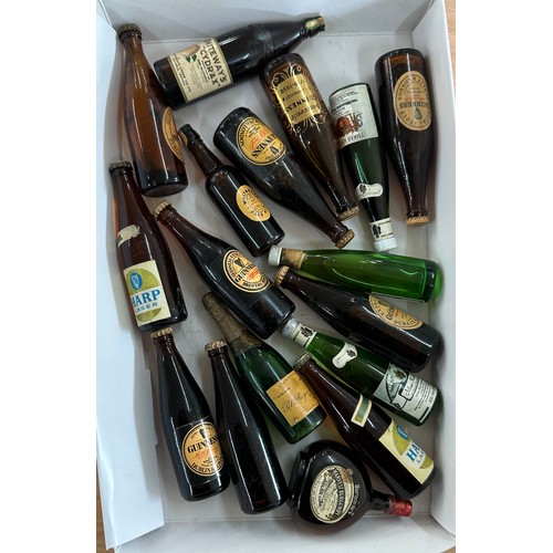 521 - Selection of vintage miniature Guiness bottles