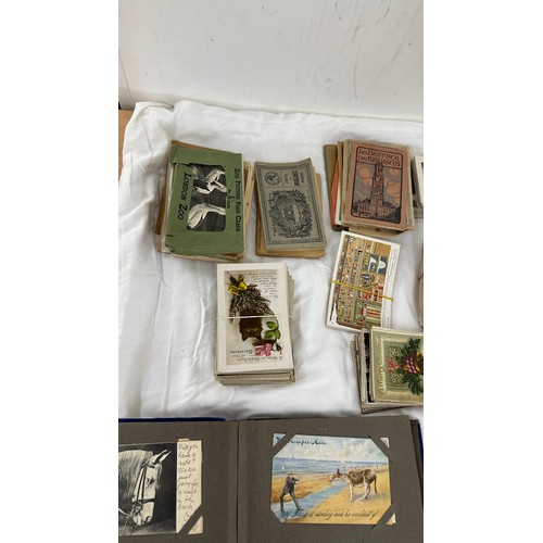 129 - Selection of vintage and later post cards includes postcard album