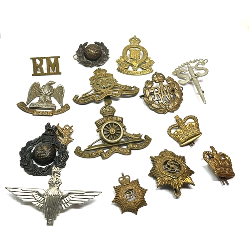 360 - Selection of military cap badges etc