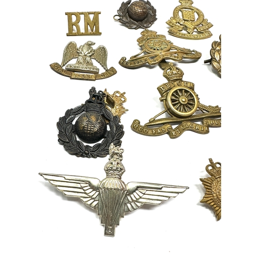 360 - Selection of military cap badges etc