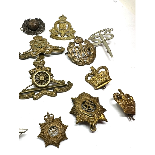 360 - Selection of military cap badges etc