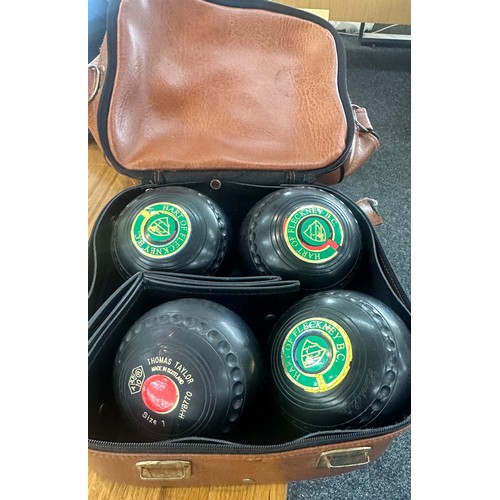 235A - Selection of assorted vintage lawn bowls to include Thomas Taylor and bag