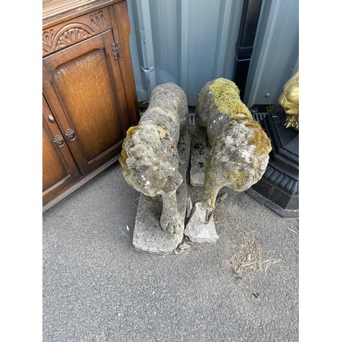 100R - Pair of Concrete lion figures measures approximately 23 inches tall 28 inches lonf 8 inches wide