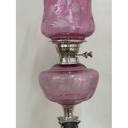 635 - Silver plated column base walker and hall oil lamp with cranberry glass shade total height approxima... 