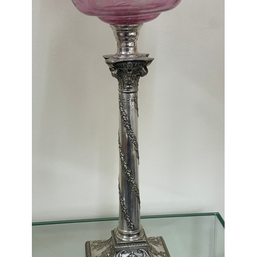 635 - Silver plated column base walker and hall oil lamp with cranberry glass shade total height approxima... 