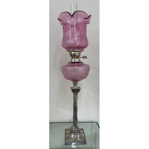 635 - Silver plated column base walker and hall oil lamp with cranberry glass shade total height approxima... 