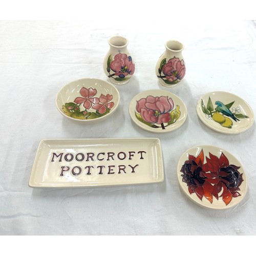 625 - Selection Moorcroft pottery to include a selection of cream pin trays, small vases etc one vase a/f ... 