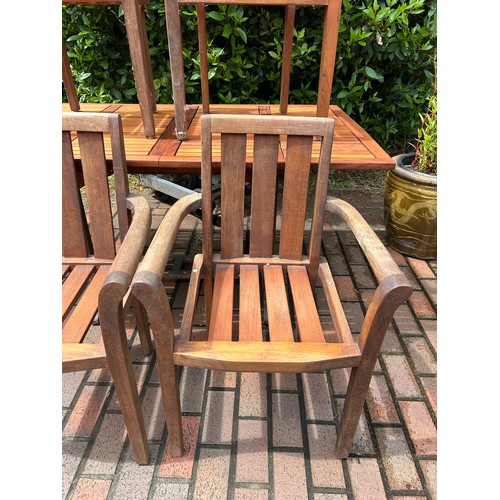 41 - Teak garden table and 4 matching chairs Length of table 59 inches, Width 35 inches