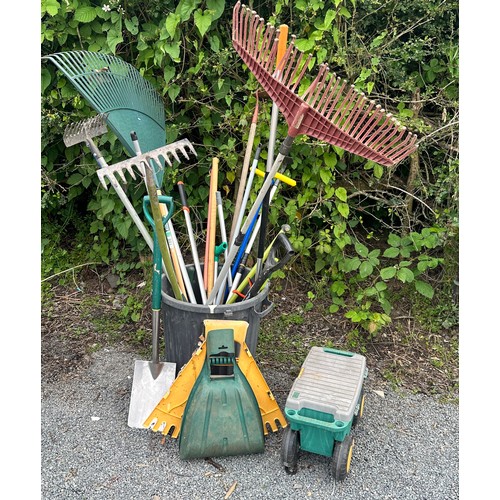 82 - Selection of garden tools to include rakes, shovels, hose etc
