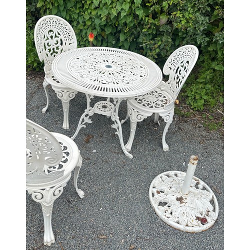 43 - Aluminium table and three chairs with parasol base