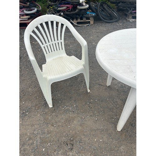 87 - Plastic garden table and two chairs
