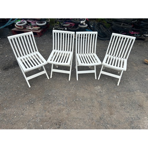 85 - Four folding plastic garden chairs