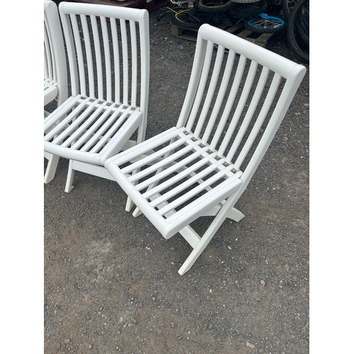 85 - Four folding plastic garden chairs