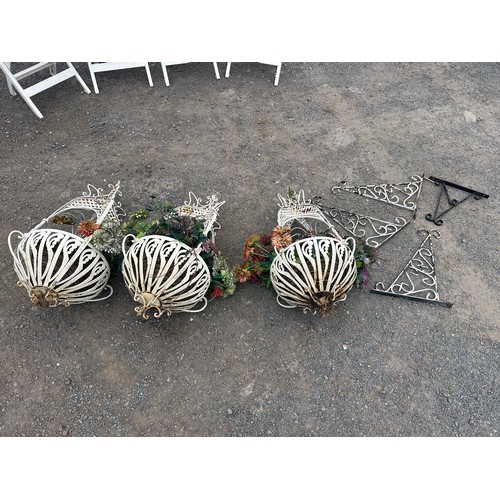 5 - Set of three ornate metal hanging plant stands and three wall brackets measure approx 33 inches tall