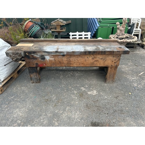 79 - Wooden work bench with a recod 52 vice measures approx 32 inches tall, 32 deep and 89 long
