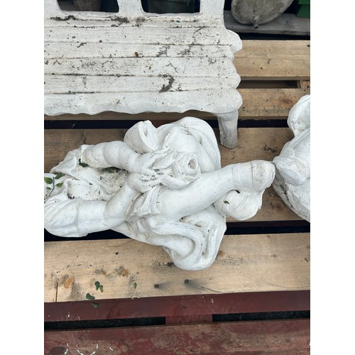 45 - Out door concrete feature of a boy and girl on a bench measures approx 28 inches tall, 30 wide and 2... 