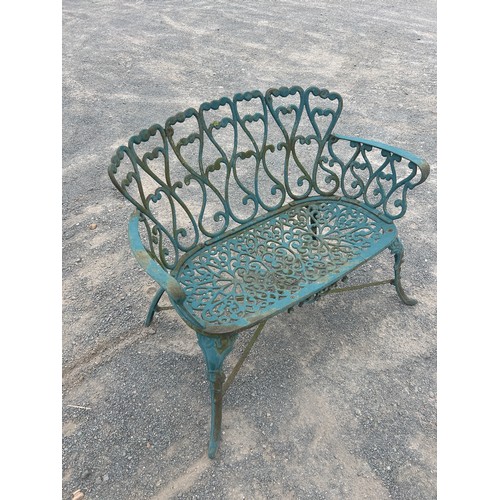 60 - Ornate cast iron garden bench measures approx 31 inches tall by 36 wide