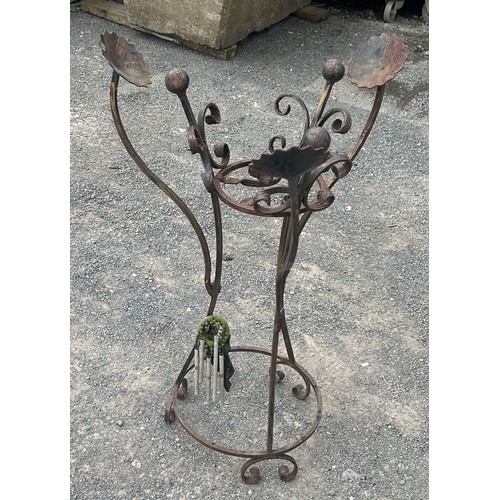 21 - Wrought iron plant stand measures approximately 33 inches tall 21 inches diameter