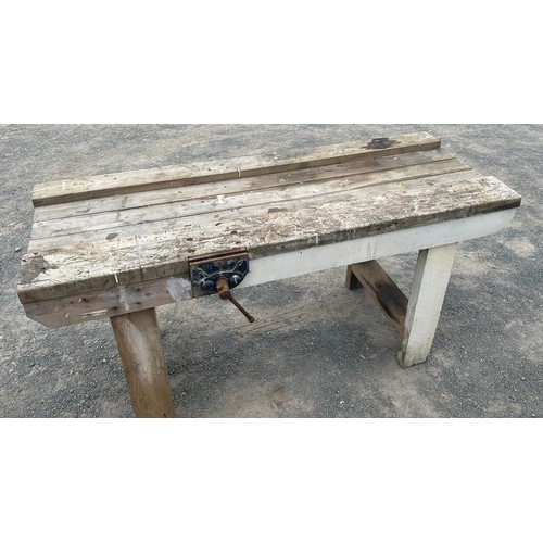 81 - Wooden workbench with table vice measures approximately 27 inches depth 67 inches wide 34 inches tal... 