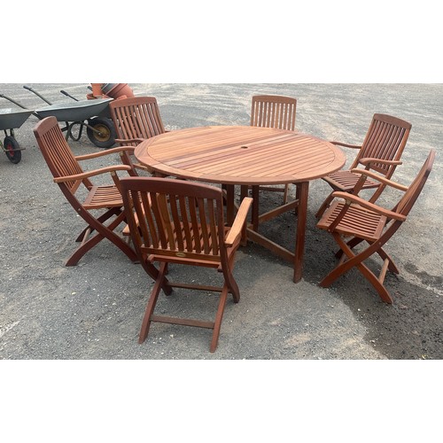62 - Teak drop leaf garden table and 6 folding chairs, with parasol and chair cushions approx diameter of... 