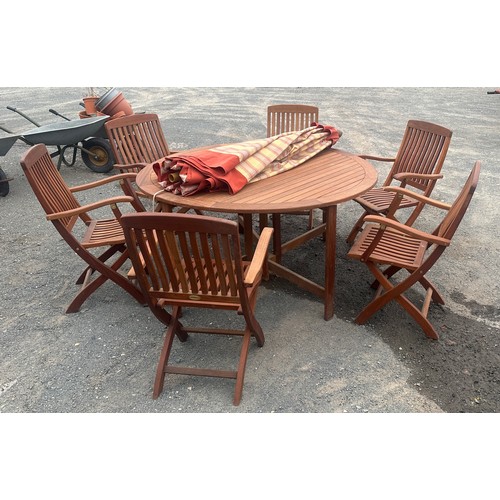 62 - Teak drop leaf garden table and 6 folding chairs, with parasol and chair cushions approx diameter of... 