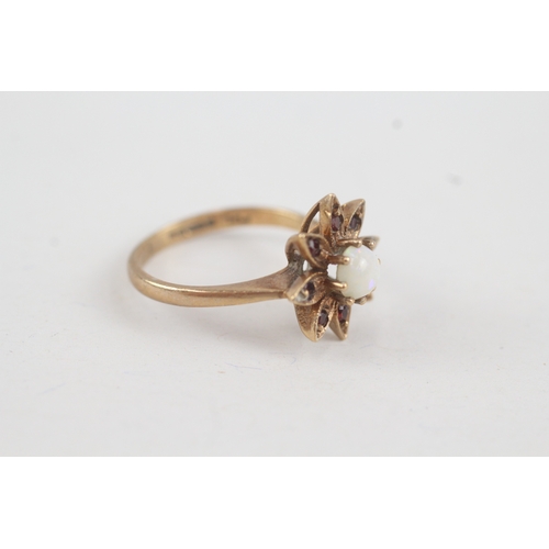 218 - 9ct gold garnet and opal set flower dress ring (2.4g)