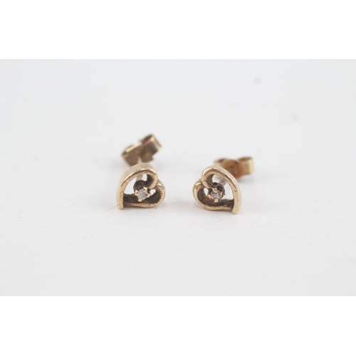 121 - 9ct gold diamond heart shaped stud earrings with scroll backs (1g)