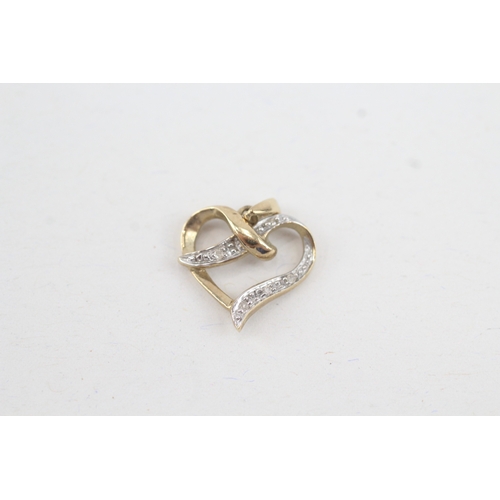 124 - 9ct gold diamond heart shaped pendant (0.9g)