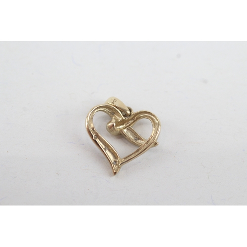 124 - 9ct gold diamond heart shaped pendant (0.9g)