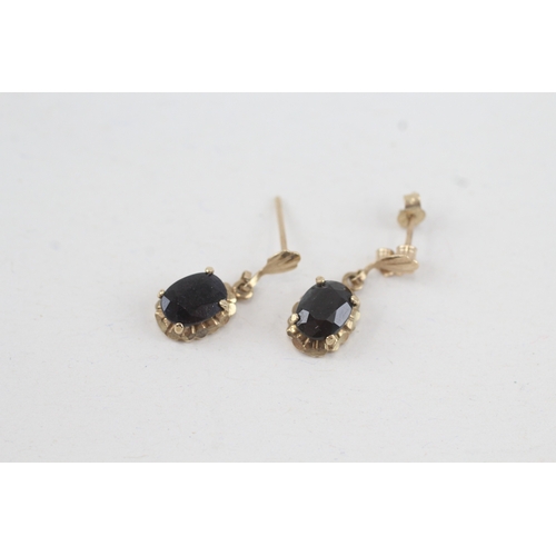 130 - 9ct gold oval cut sapphire drop earrings with scroll backs (1.1g)