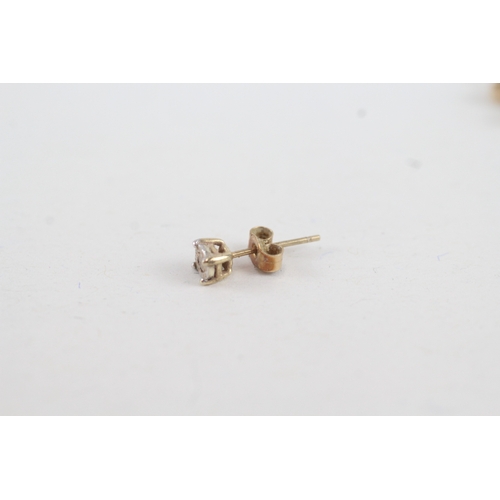 182 - 2 x 9ct gold diamond set solitaire stud earrings (0.8g)