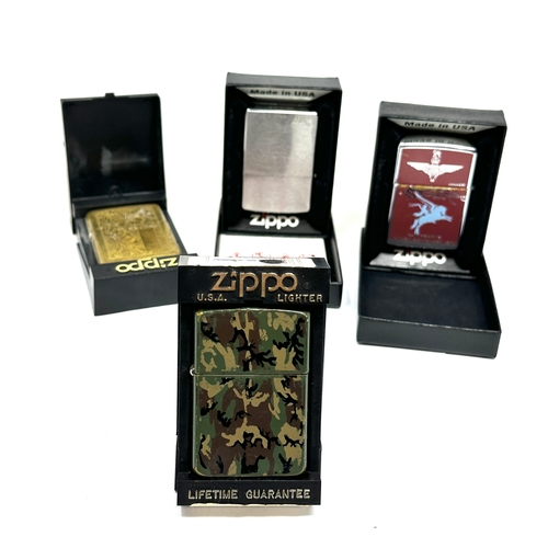 429 - 4 boxed vintage Zippo lighters