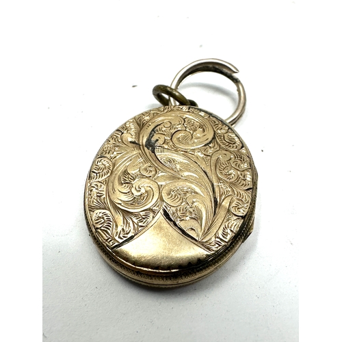 106 - Antique 9ct gold back & front enamel locket measures approx 2.9cm drop